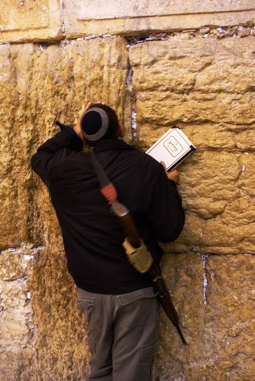 Israel, Jerusalem, soldier praying in Western Wall