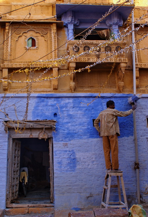 India, Jaisalmer, painting house for diwali